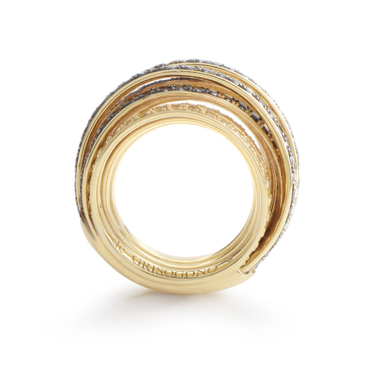 This highly luxurious ring from de Grisogono's Allegra collection is without comparison. The outer surface of the ring is paved with a combination of 2.90 carats of black diamonds and 2.50 carats of gleaming yellow sapphires; the perfect compliment