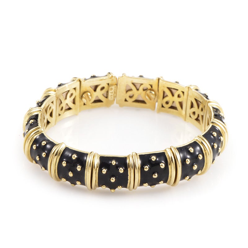 Providing a stark contrast for an eye-catching appearance, the black enamel presents a perfect backdrop for the warm, bright radiance of 18K yellow gold in this incredibly appealing bracelet from Hidalgo.