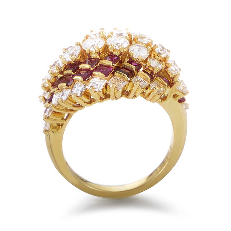 The subtle 18K yellow gold body suddenly escalates into an extraordinary arrangement of diversely cut diamonds weighing approximately 3.00 carats and vivacious rubies weighing approximately 2.00 carats for a majestic, luxurious allure and a