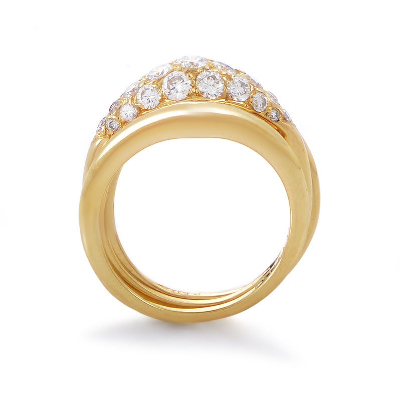 The shimmering, smoothly flowing 18K yellow gold body of this enchanting ring from Van Cleef & Arpels expands and opens upwards to host a delightful arrangement of glittering diamonds weighing 1.12 carats in total.
Ring Size: 6.5
Included Items: