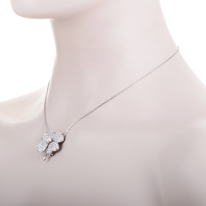 Designed in the symbolic shape of the mysterious four-leaf clover, the dazzling 18K white gold pendant of this impressive necklace from Van Cleef & Arpels is paved with 3.49 carats of diamonds and features a .50 carat center stone. Lastly, this