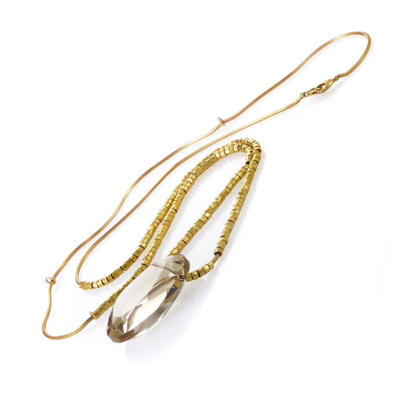 Exotic and exceptionally designed, this necklace from H. Stern is a real gem. The necklace is made of 18K yellow gold and is accented with a faceted white topaz pendant.

Approximate Dimensions: Drop of the Necklace: 16.50