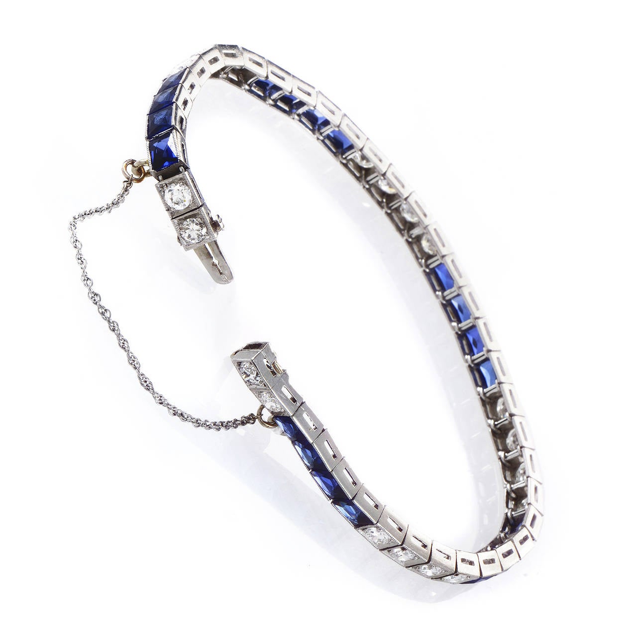 This gorgeous antique design will always be in style. The bracelet is made of platinum and is set with white diamonds and blue stones.

Diamond Carat Weight: 4.00