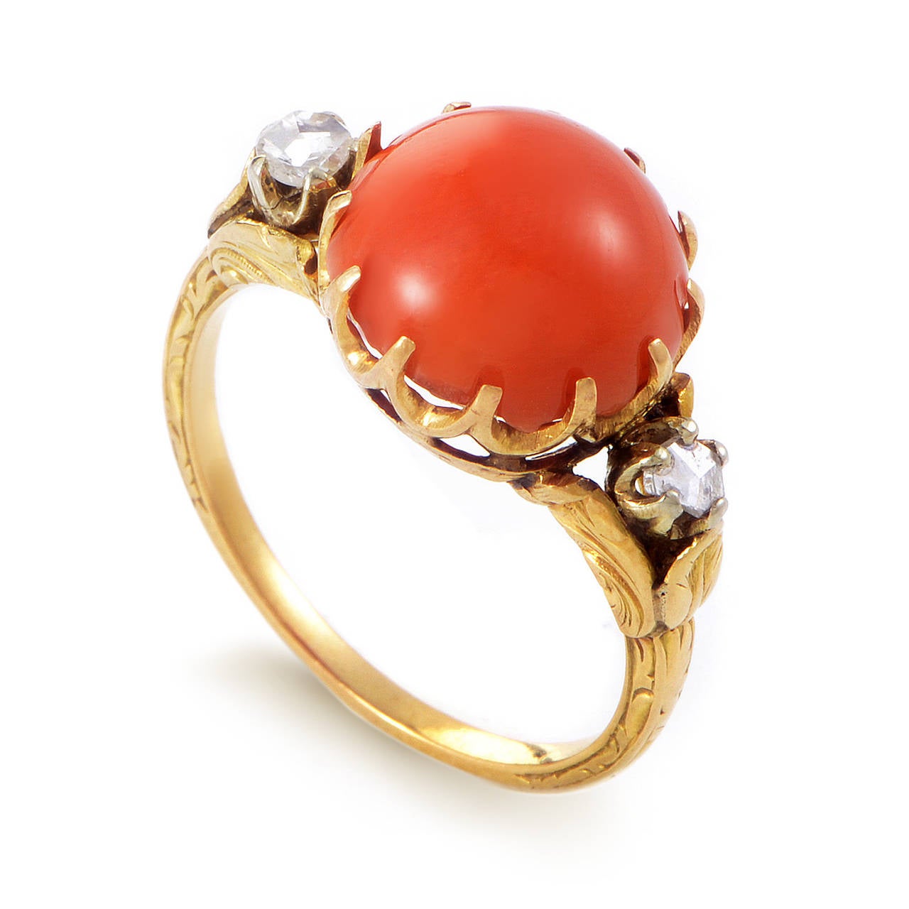 This set is absolutely stunning and contains two intricately designed pieces. A ring and earring set made of both 18K yellow gold and are set with coral cabochons. Lastly, diamonds add a touch of elegance to the overall design.

Weight: Earring