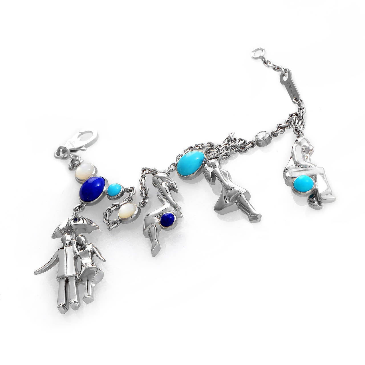 This fantastic charm bracelet from Van Cleef is finely crafted to exude a subtle air of femininity and luxury. The bracelet is made of 18K white gold and features adorable charms accented with lapis, turquoise, and mother of pearl.