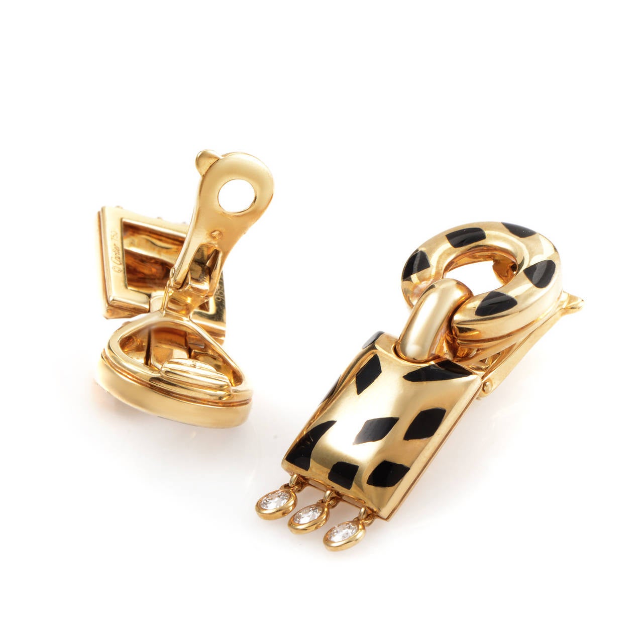 This memorable set of earrings entwines dramatic details and high-quality materials to make a design that could only come from Cartier. The earrings are made of 18K yellow gold and are accented with black enamel 