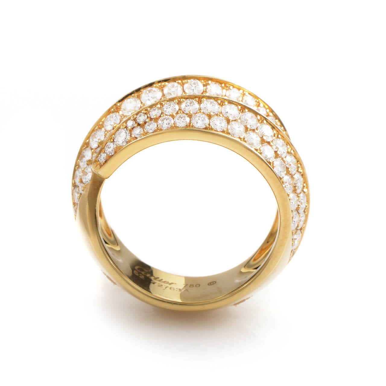 A graceful arc of gold paired with the luxurious shimmer of precious gems makes this Cartier ring a real standout! The ring is made of 18K yellow gold and is set with a 1.60 carat partial diamond pave.
Included Items: Manufacturer's Box
Ring Size: