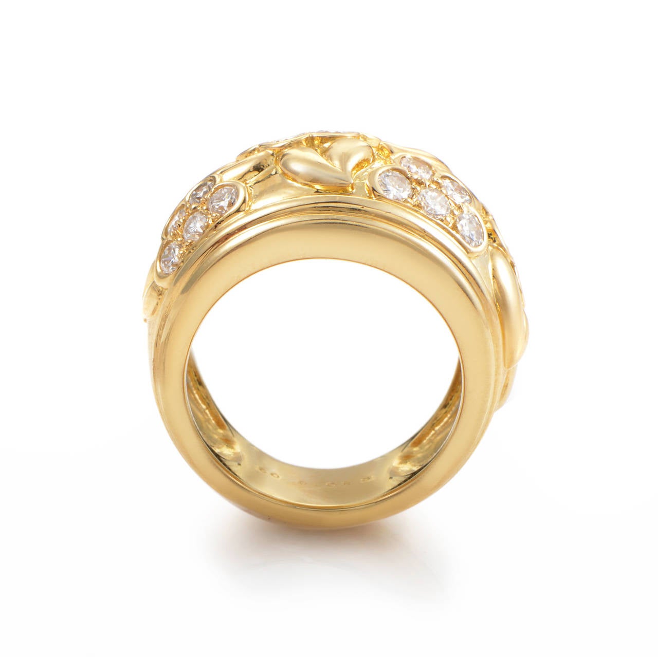 This band ring from Dior has a phenomenal design that sparkles with the finest of diamonds. The ring is made of 18K yellow gold and boasts a floral diamond design. Absolutely marvelous!

Ring Size: 6.25 (52 1/8)
Diamond Carat Weight: 1.00