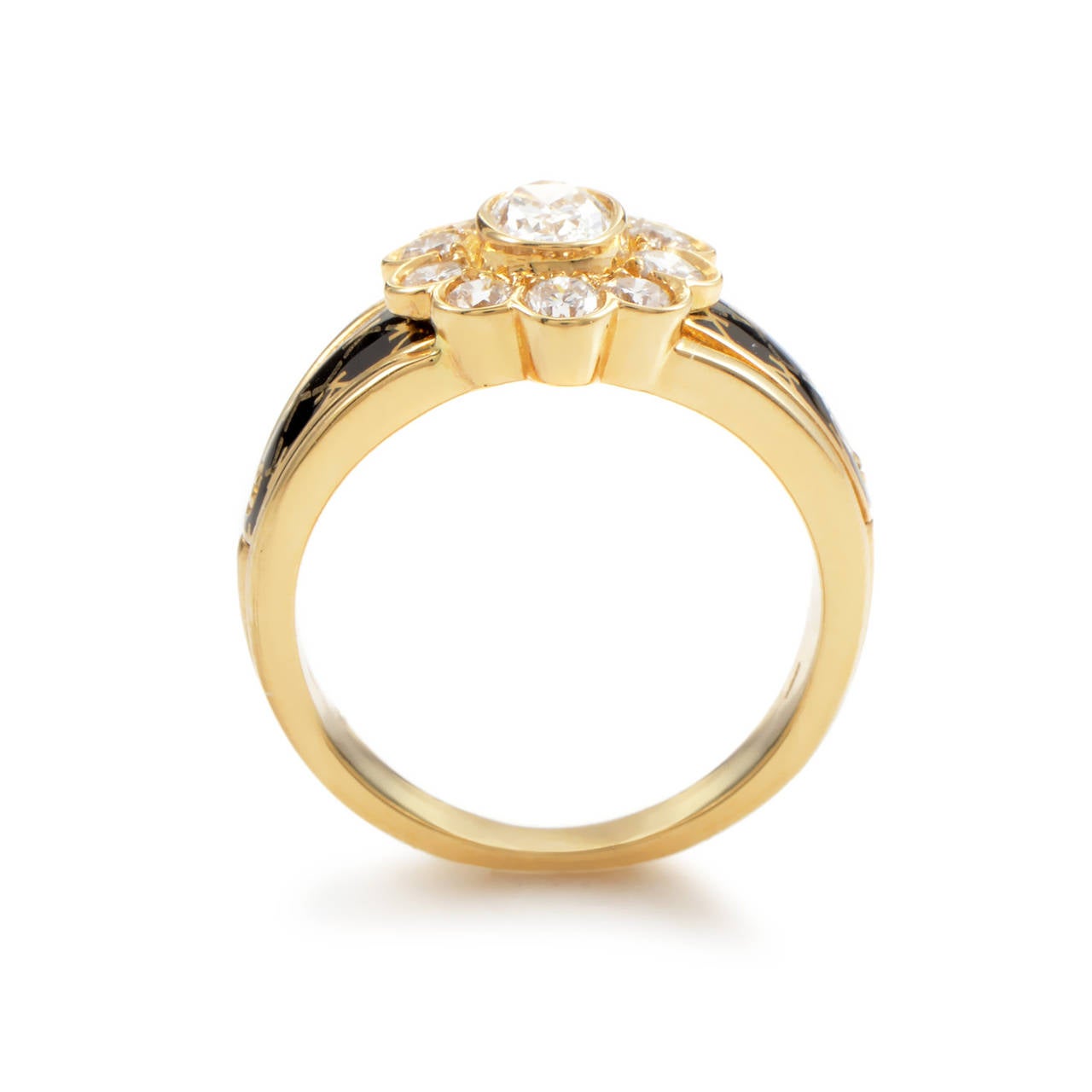 Feast your eyes upon the decadent design of this ring from Korloff! The ring is made of 18K yellow gold and boasts shanks set with black enamel. Lastly, the main attraction is a dazzling flower made entirely of diamonds. The center weights .50