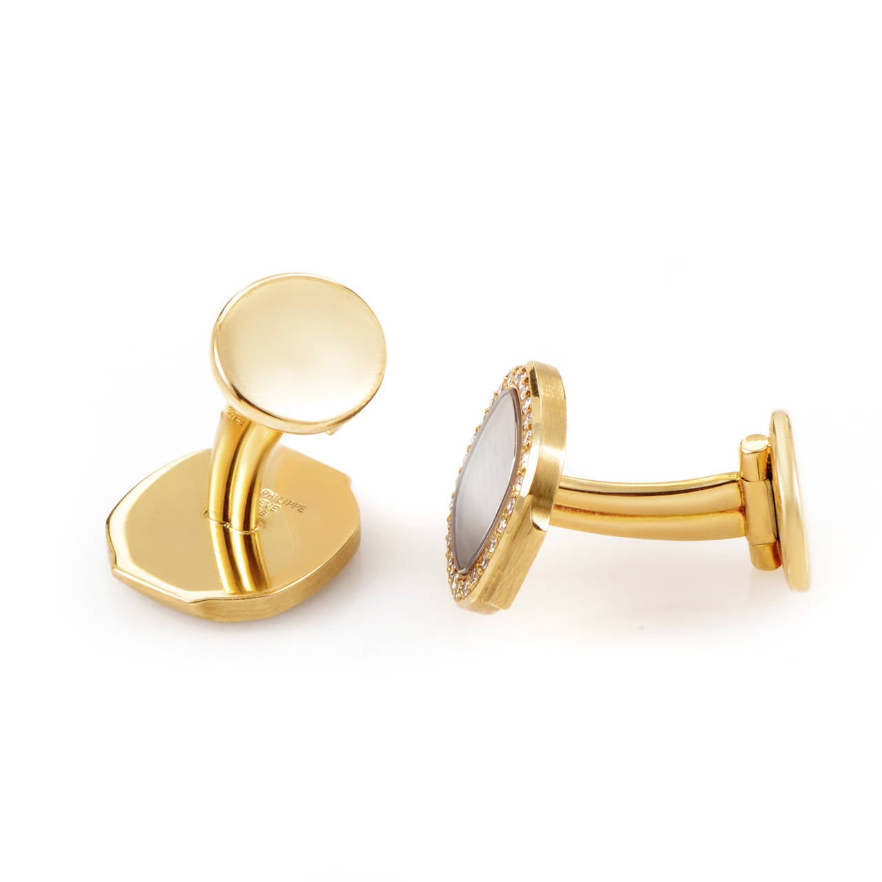 This refined pair of cufflinks from Patek Philippe's Nautilus collection have a tasteful look perfect for a sophisticated gent or lady. The cufflinks are made of 18K yellow gold and boast the Nautilus design as well as the inclusion of diamonds for