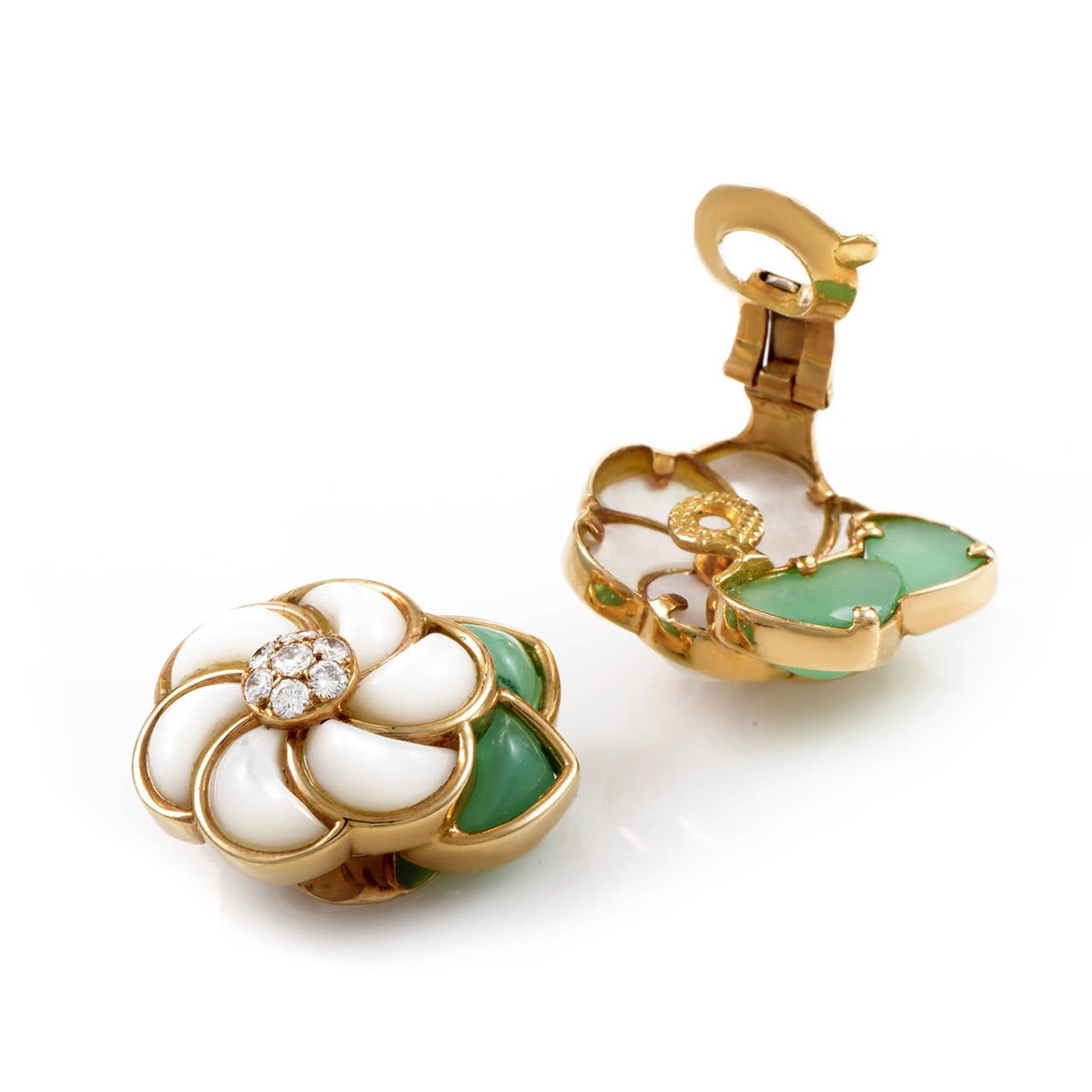 Feast your eyes upon the decadent design of this pair of earrings from Van Cleef & Arpels! The earrings are made of 18K yellow gold and depict flowers with diamond-set centers, mother of pearl petals, and green jade leaves. Absolutely