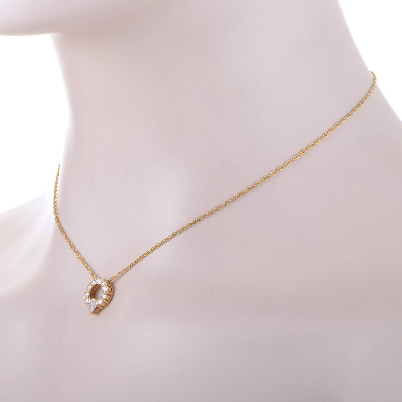 Golden and glorious, this glamorous necklace from Celine is absolutely stunning! The necklace is made of 18K yellow gold and features a delicate .85 carat diamond set pendant.
Approximate Dimensions: Drop of the Necklace: 8.00