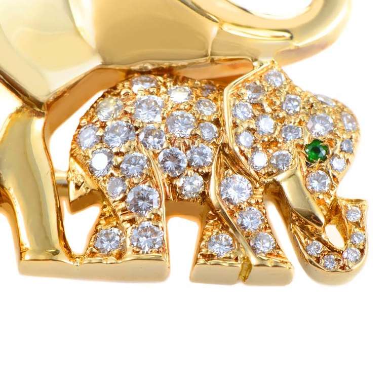 This expertly crafted brooch from Cartier is lavish and lovely. The brooch is made of solid 18K yellow gold and depicts a mother elephant and her baby. The young elephant is set with an ~.50ct diamond pave, and each elephant has an eye made of