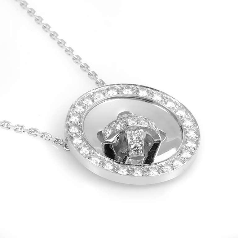 This pendant necklace from Van Cleef & Arpels is cute as a button! The necklace is made of 18K white gold and boasts a button-shaped pendant set with diamonds.
Approximate Dimensions: Drop of the Necklace: 8.75