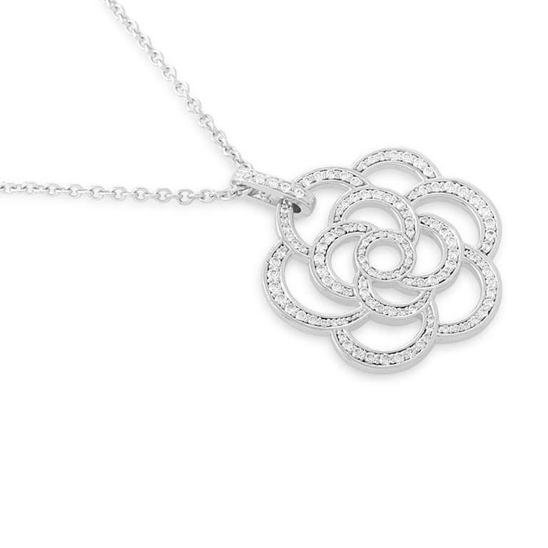 The camellia blossom was Coco Chanel's favorite flower and is prominently featured in various Chanel designs. This 18K white gold pendant necklace features a fairly large openwork camellia pendant set with diamonds.
Diamond Carat Weight: