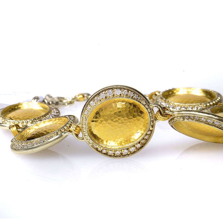 Opulent and fit for a queen, this magnificent bracelet from Gurhan is a true standout among other fine jewelry. The bracelet is made of 24K yellow gold and features six discs accented with shimmering white diamonds.
Retail Price: $23,000.00