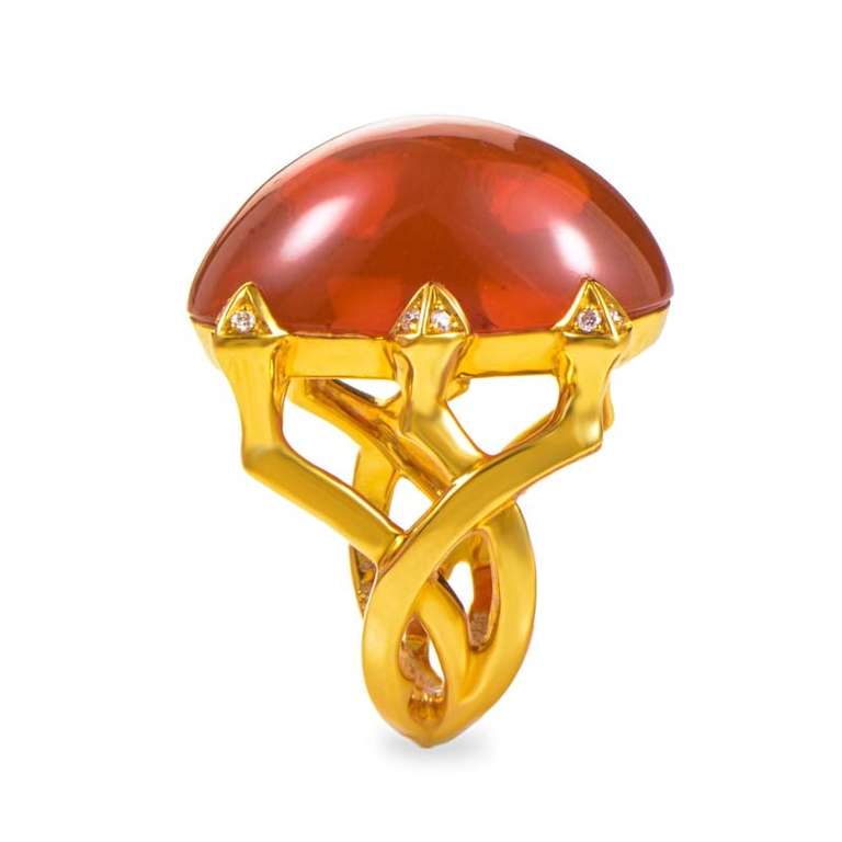 This Stephen Webster ring is gorgeous and is a wonderful statement piece. The ring is made of 18K yellow gold and boasts a large citrine cabochon accented with plush white diamonds.
Ring Size: 6.25
Retail Price: $9,500.00