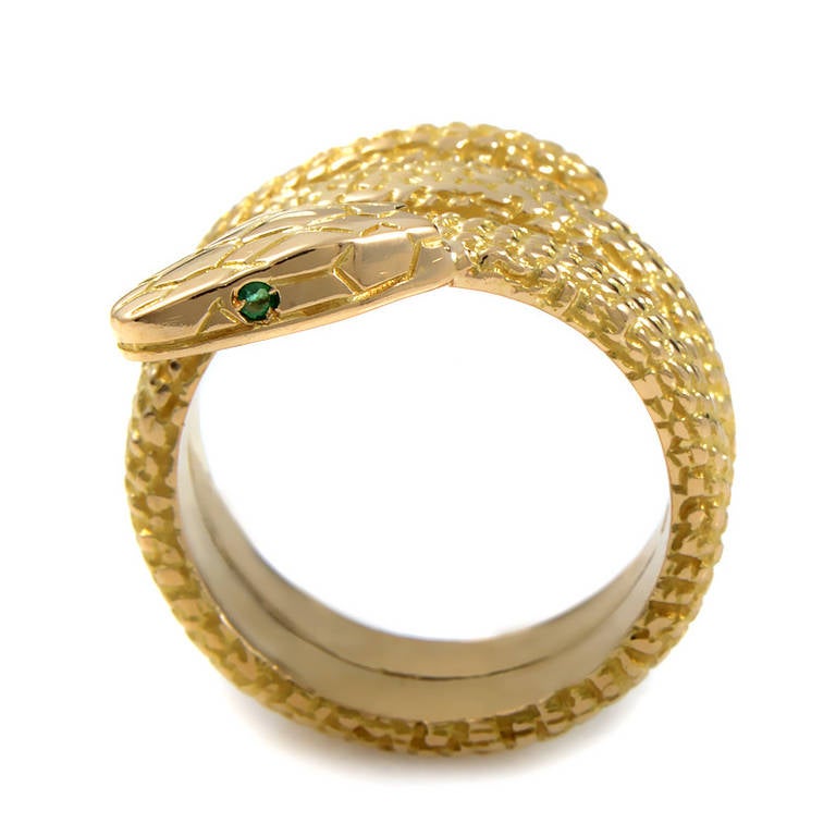 This eye-catching ring from Cartier is lavish in design, and will surely entice you to wear it time and time again. The ring is made of 18K yellow gold and is shaped like a coiled snake. Lastly, the snake steadily gazes upon you with two glimmering