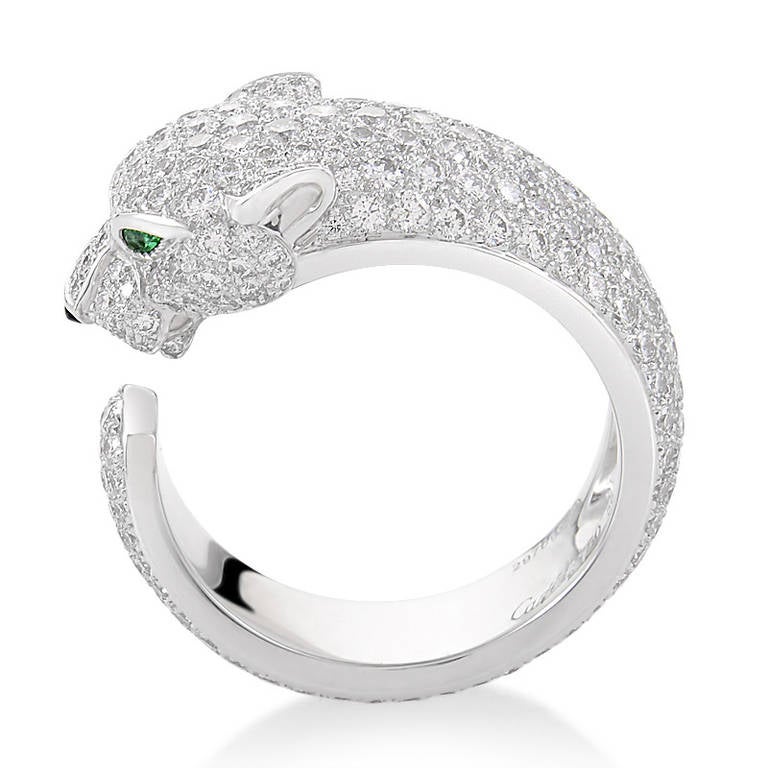 A fiercely fabulous design, the Panthere de Cartier 18K White Gold Diamond Pave Band Ring is sure to garner much attention. The ring is made of 18K white gold and is shaped to portray a panther. The panther is set with a shimmering white diamond