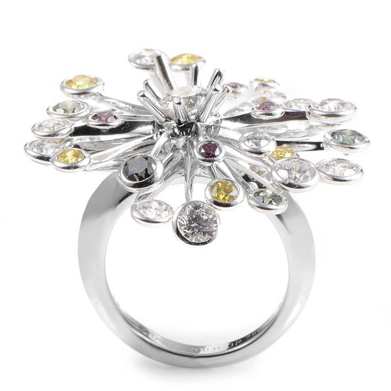 A rare and fantastic delight, this starburst ring from Chanel is set with a rainbow of natural diamonds. The ring is made of 18K white gold and is set with white, yellow, green, and pink diamonds.
Ring Size: 6.0 (51 1/2)
Diamond Carat Weight: