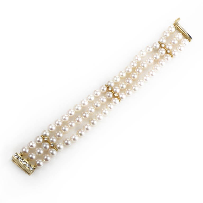 Mikimoto is world renowned for their sumptuous pearl designs and this bracelet from the brand is a perfect example of the company's jewelry-making prowess. The bracelet is a three row pearl pinkish-white cultured pearl bracelet with 18K yellow gold