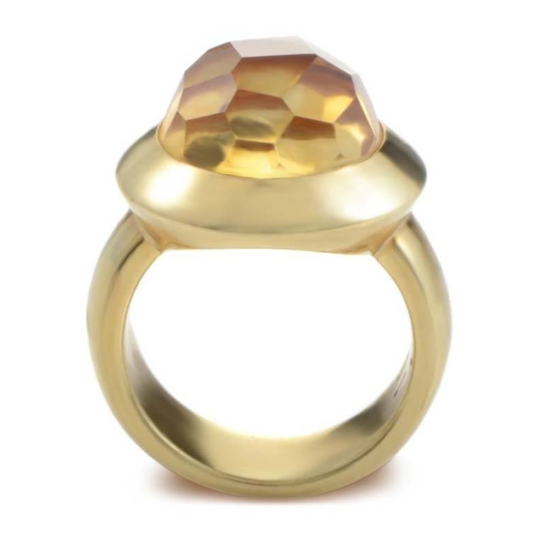 This ring has a fantastic look that could have only come from a brand such as Pomellato. The ring is made of 18K yellow gold and features a bezel set faceted citrine stone. 

Ring Size: 6.75 (53 3/8)