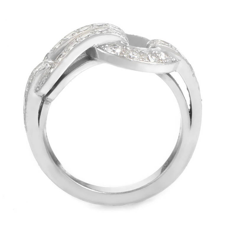 True to standard, this ring from the House of Cartier's Agrafe collection is of the highest quality. The ring is made of 18K white gold and features the Agrafe motif set with glittering white diamonds.
Ring Size: 4.75 (48 3/8)
Retail Price: