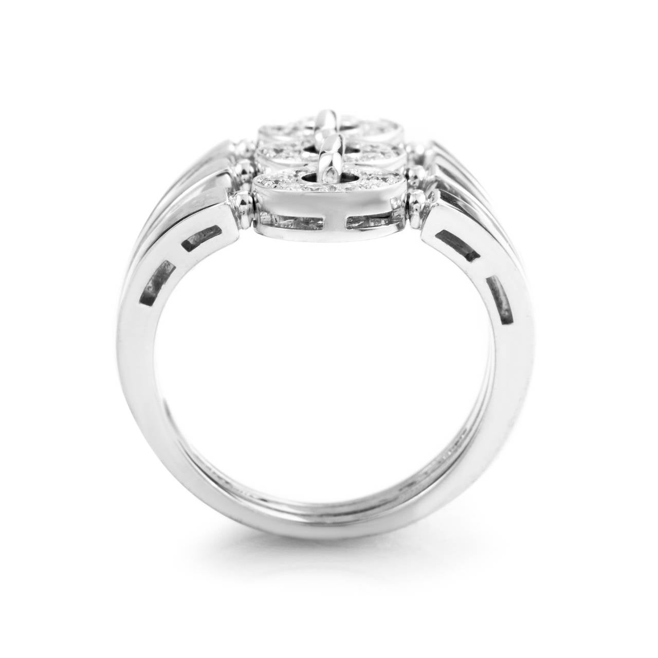 The unique design of this ring from Bvlgari is sure to garner much attention. The ring is comprised of three 18K white gold bands forged together and accented with .60 carats of diamonds.
Included Items: Manufacturer's Box
Ring Size: 6.0 (51 1/2)