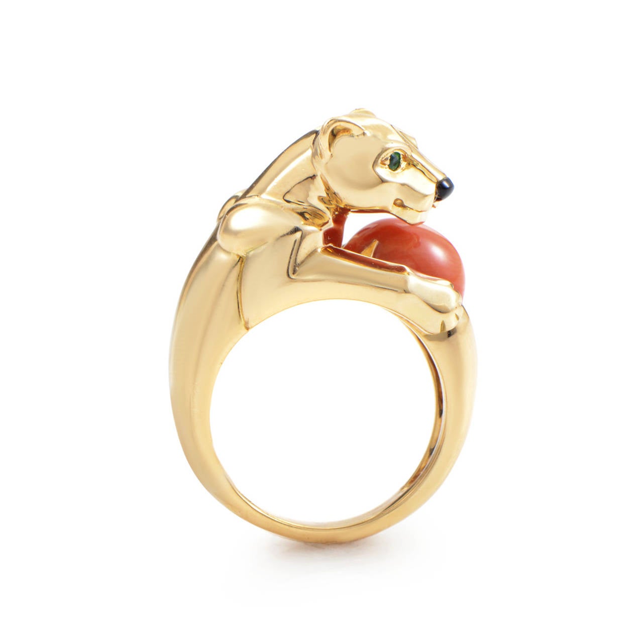 With an imaginative design and a wonderful combination of 18K yellow gold and precious gemstones, this Cartier Panthere ring is sure to please! The ring is made of 18K yellow gold and boasts a panther-shaped motif with green emerald eyes, an onyx