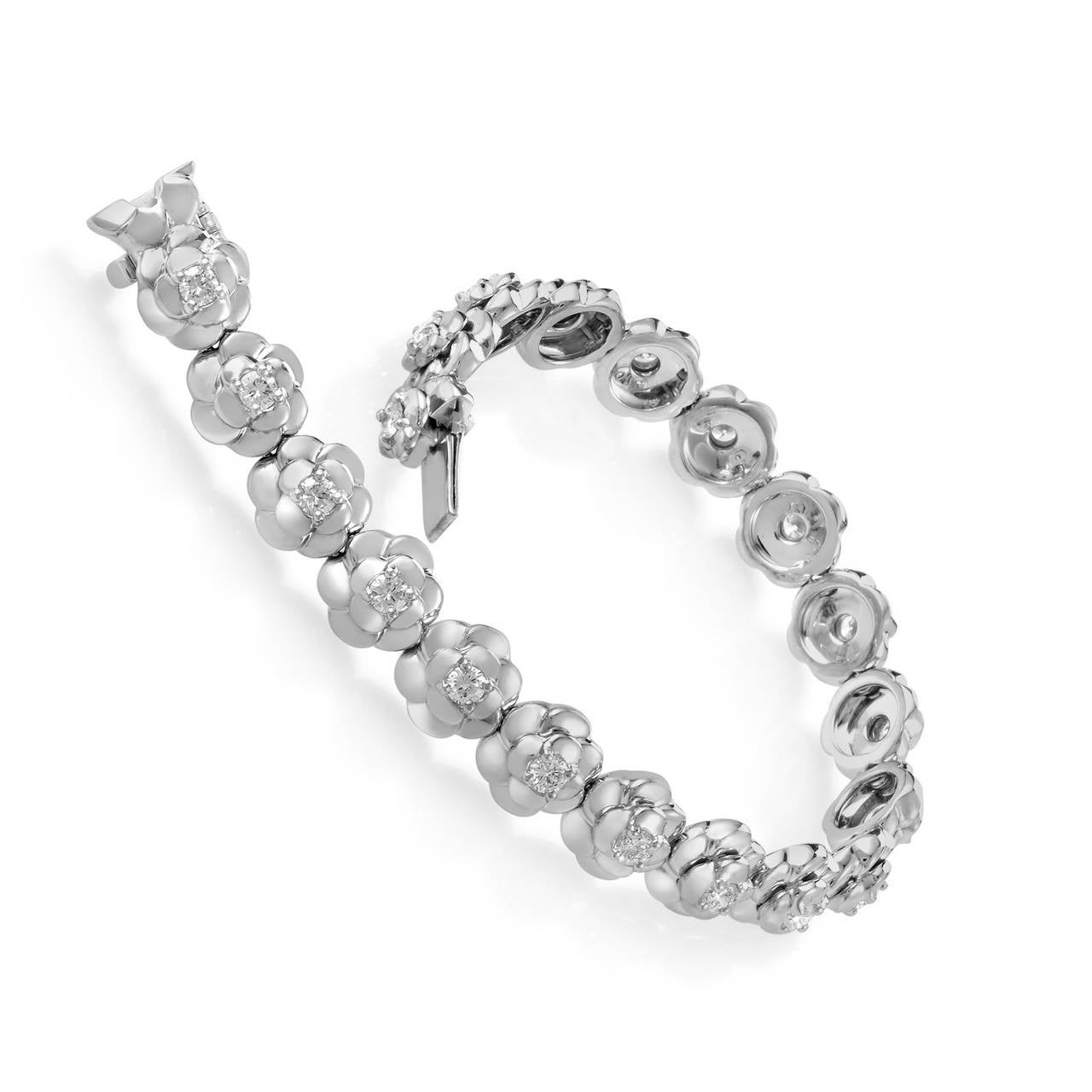 Splendidly graceful and feminine, this gorgeous Chanel bracelet from the extravagant Camélia collection boasts charming floral design lavishly decorated with dazzling diamond stones weighing approximately 2.50 carats in total. The bracelet is made