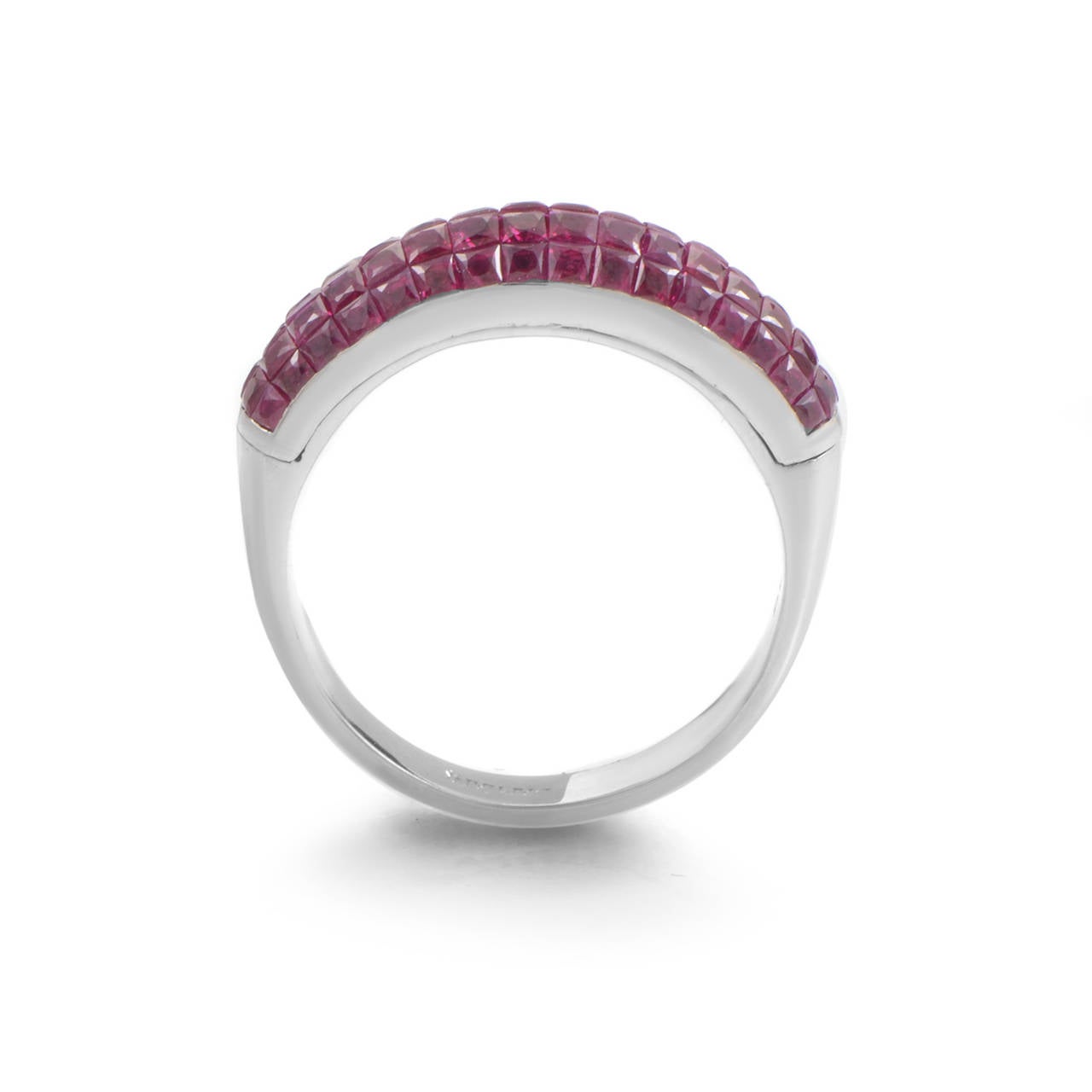 An appealing combination of cool tones of white gold and eye-catching hue of striking rubies, this majestic ring from Damiani boasts tasteful alluring appearance that will look great in any occasion; the ring weighs seven grams, while the gems total