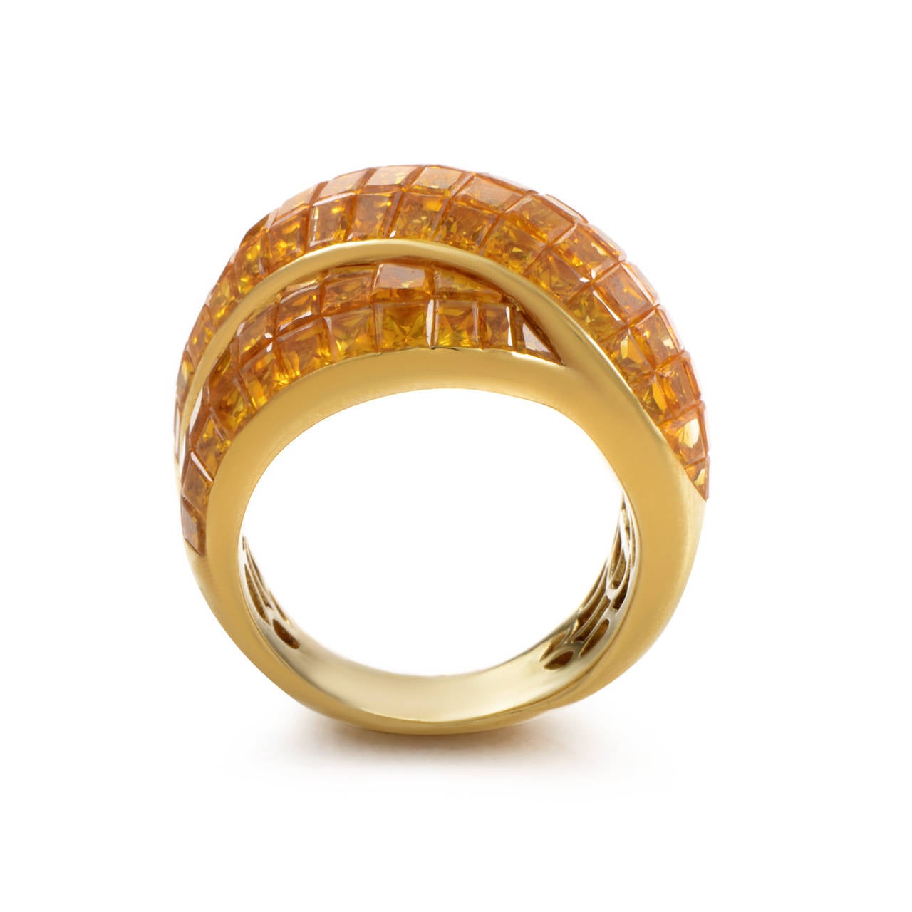 Boasting a captivating combination of radiant 18K yellow gold and attractive yellow sapphires this Damiani ring is a piece that will not go unnoticed; the ring weighs 18 grams while the sapphire stones total 7.50 carats.
Ring Size: 7.0 (54)