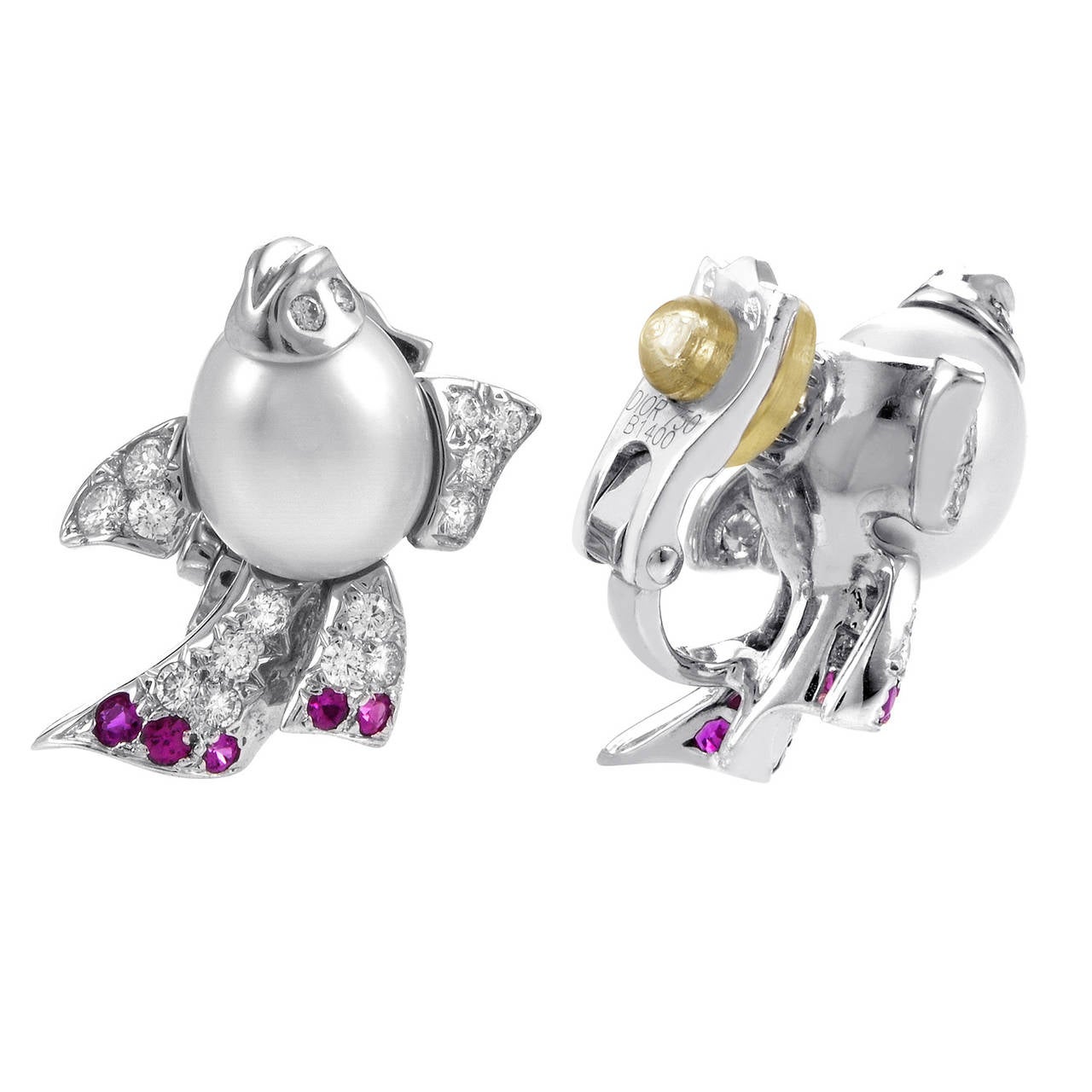 Prepare to delight yourself with the beauty of this pair of clip-on earrings from Dior. The earrings are made of 18K white gold and are set with diamonds, pearls, and rubies.