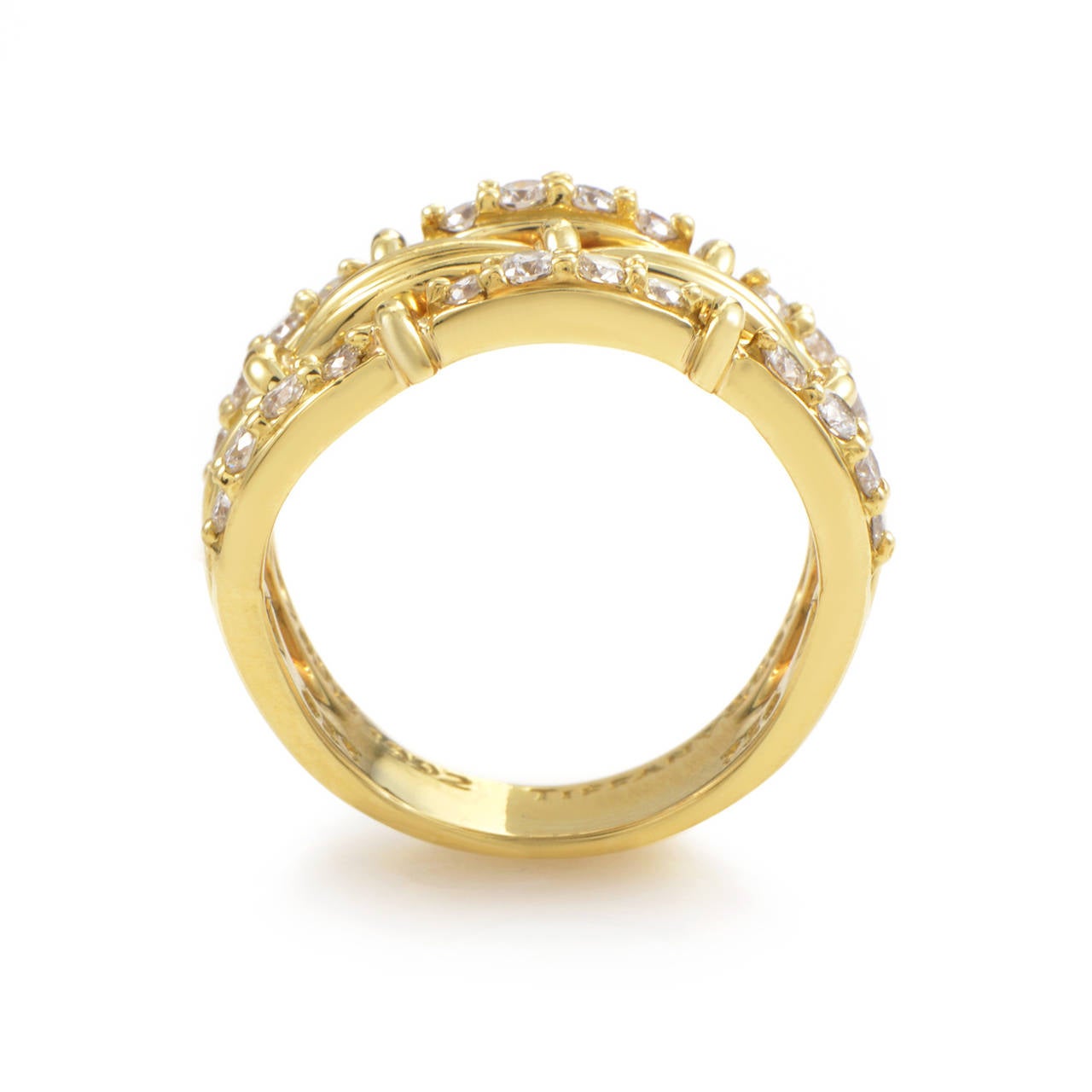 A gorgeous design from Tiffany & Co. that is sure to please! This band ring is made of 18K yellow gold and is set with a gorgeous array of .60 carats of diamonds.

Ring Size: 6.0 (51 1/2)