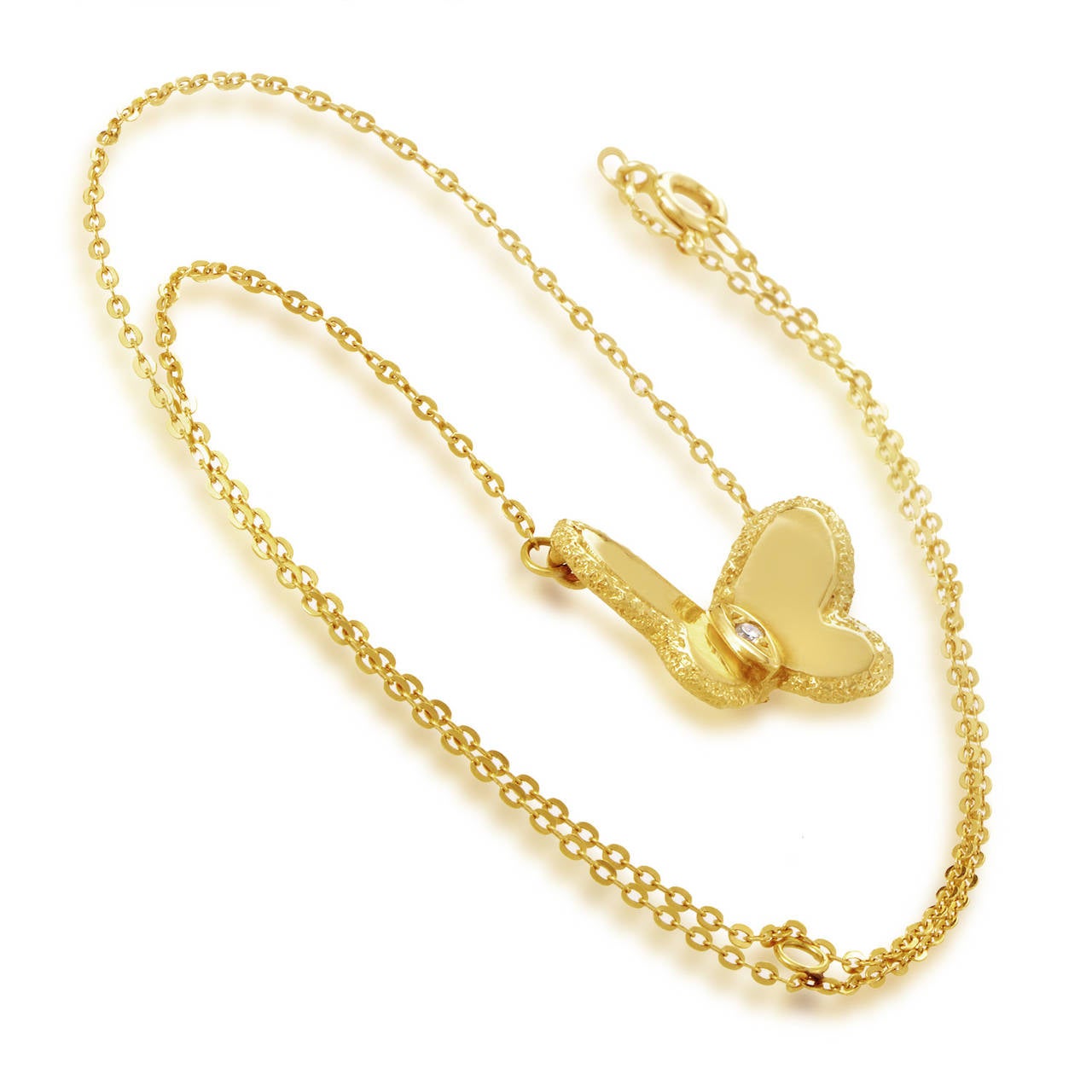 With its butterfly-shaped centerpiece this Van Cleef & Arpels necklace achieves a very charming and feminine appearance. The necklace is made of 18K yellow gold and the butterfly-shaped pendant is set with a single diamond in its