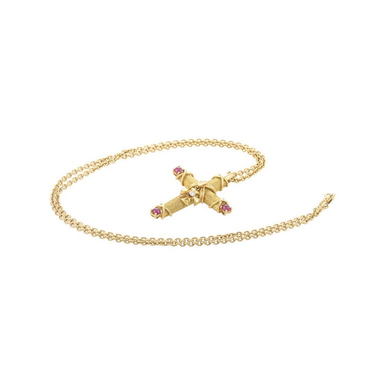 Famed jeweler Jean Schlumberger and Tiffany & Co. teamed up to make an exceptional line of jewelry that has become popular world wide. This pendant necklace from Schlumberger's collection is made of 18K yellow gold and boasts a cross-shaped pendant