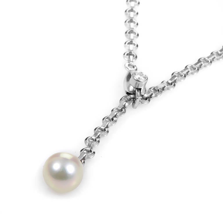 Simple and sweet, this lariat-style necklace has a refined look that could only come from Cartier. The necklace is made of 18K white gold and boasts a lustrous white pearl pendant. Lastly, the lariat clasp is set with a single white