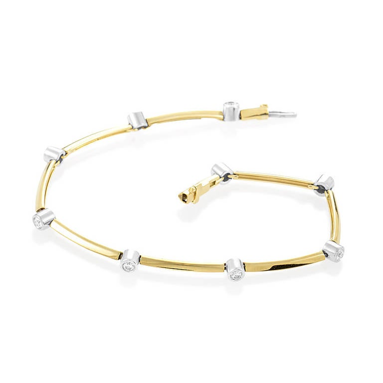 The gorgeous diamonds found in the design of this bracelet from Tiffany & Co.'s Etoile collection shine just as brightly as the etoiles (stars) they were named after. The bracelet is made primarily of 18K yellow gold and features diamonds set in