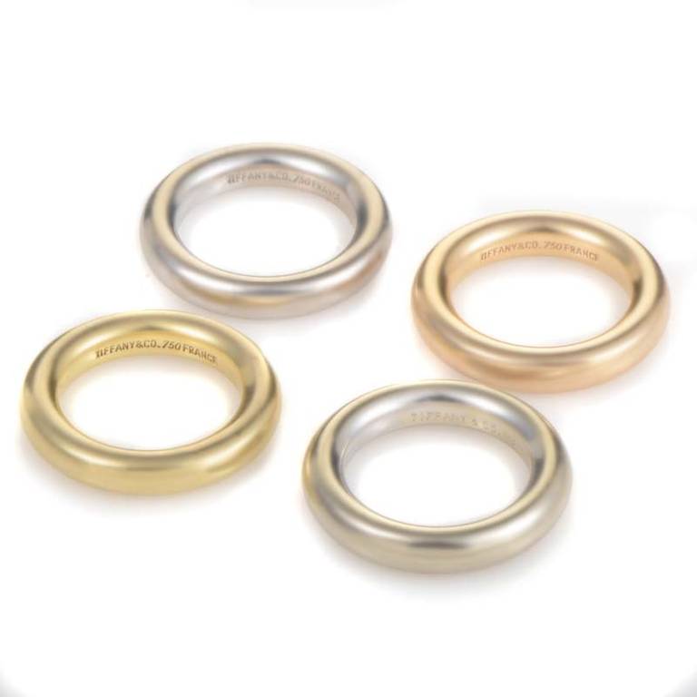 Simple and sweet, this assortment of rings from Tiffany & Co. will pair quite nicely with many other articles of jewelry. The set is comprised of four band rings; two white gold, one rose gold, and one yellow gold.
Ring Size:4.5 (47 3/4)