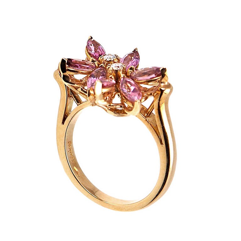 Asprey's iconic Daisy Collection presents an 18K yellow gold ring featuring two overlapping daisies.The flowers are comprised of marquise-shaped pink tourmaline and each flower has a center prong-set diamond.
Retail Price: $4,450.00 (Plus