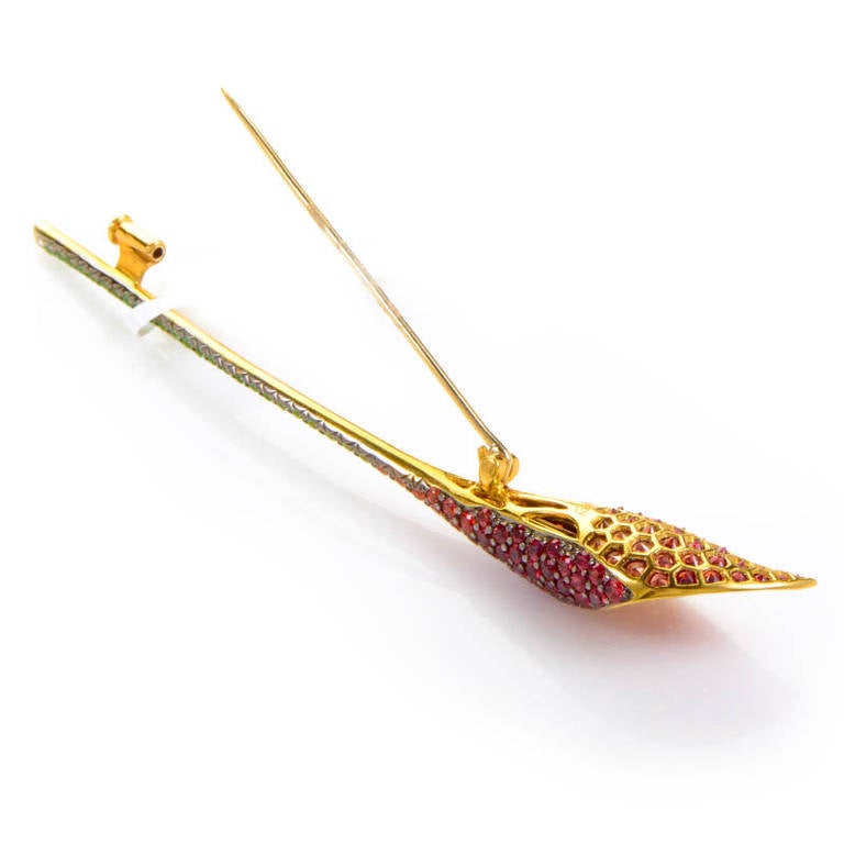 This brooch from Asprey is elegant and sophisticated. This calla lily shaped brooch is made of 18K yellow gold and boasts petals set with ~4.53ct of multi-colored sapphires. Lastly, the stem is set with ~.47ct of tsavorite.
Retail Price:$8,350.00