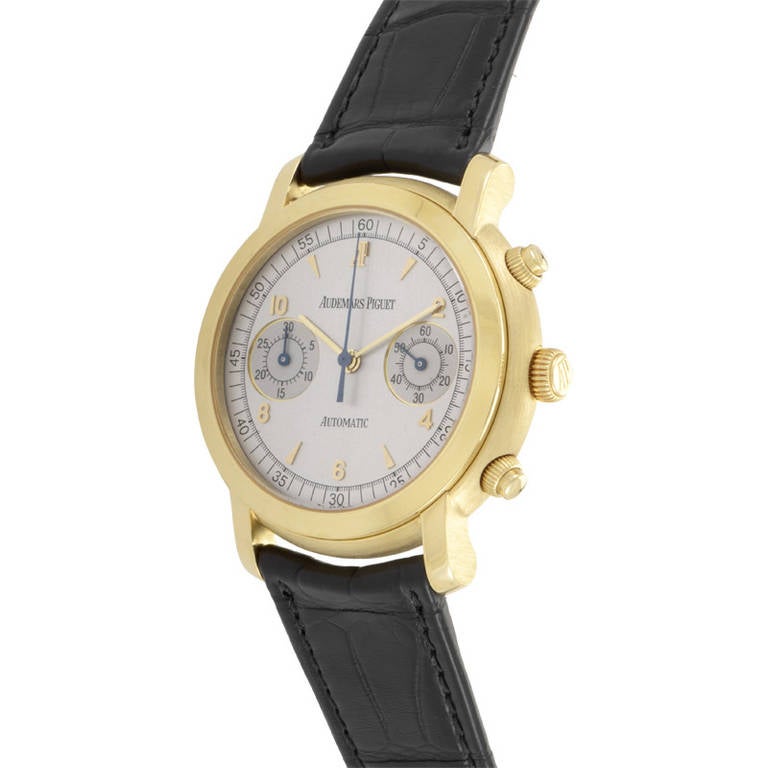 Displays hours, minutes, seconds, chronograph on a white dial. Lastly, the black alligator leather strap fastens with a deployment clasp.
Original Retail Price: $26,800.00