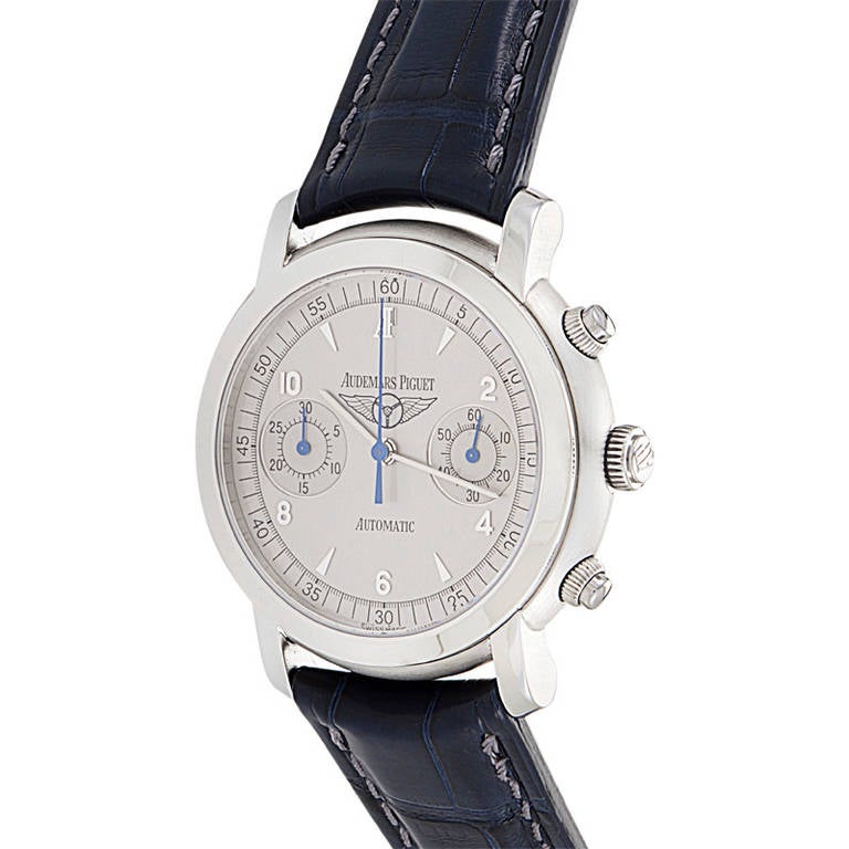 This version of the Jules Audemars Chronograph is a special limited edition produced in honor of the National Classic Tour. Displays hours, minutes, seconds, and two chronograph subdials on a silvered dial. Lastly, the blue alligator leather strap