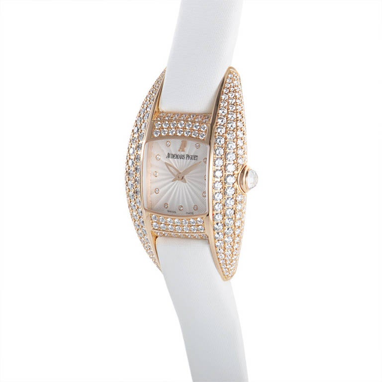 Displays hours and minutes on silver guilloche dial. The watch's rose gold case is set with a full diamond pave. Quartz movement. Lastly, the white strap fastens with a tang buckle. 
Original Retail Price: $49,100
Included Items: Manufacturer's
