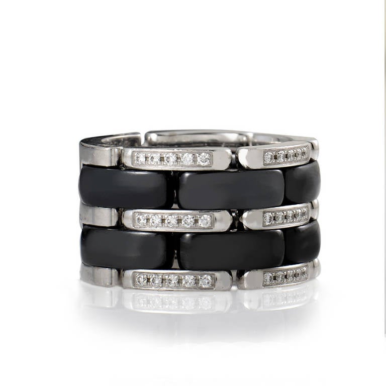 This uniquely designed band ring from Chanel's Ultra collection has a dark and sultry look that cannot be ignored! The ring is made of a combination of diamond set white gold and black hematite links. The ring is somewhat flexible, but not in