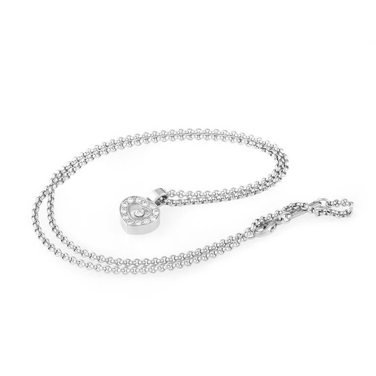 This pendant necklace from Chopard's Happy Diamonds collection is an instant classic. The necklace is made of 18K white gold and features a small heart-shaped pendant set with diamonds. Lastly, the pendant's exhibition window displays a single