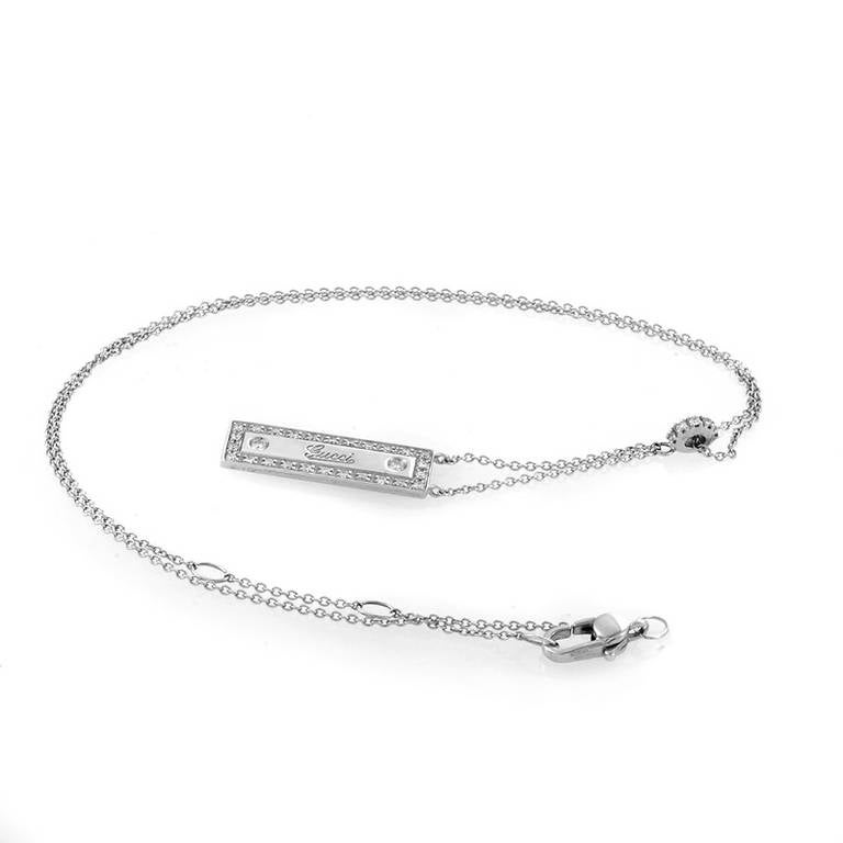 One of the world's foremost fashion houses, Gucci is renowned for their glamorous designs that are always in style. This necklace from the brand is made of 18K white gold and features a rectangular pendant lined with diamonds and accented with the