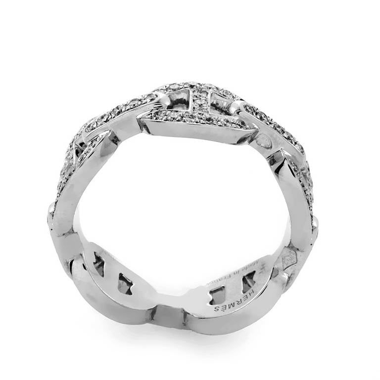 This finely crafted band ring from Hermès is a more luxurious take on the classic sterling silver version. The ring is made of diamond-set 18K white gold and is comprised of the signature Chaîne d'Ancre motif.
Ring Size: 5.75 (50 7/8)
Diamond