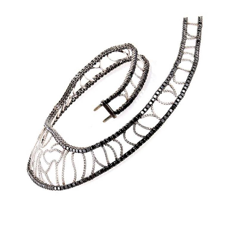 This cuff necklace from Versace's V-Medusa collection is as dark and mysterious as it's namesake. It is made of 18K white gold and boasts an openwork design set with ~3.69ct of white diamonds. Lastly, the white diamonds are accented with ~22.50ct of
