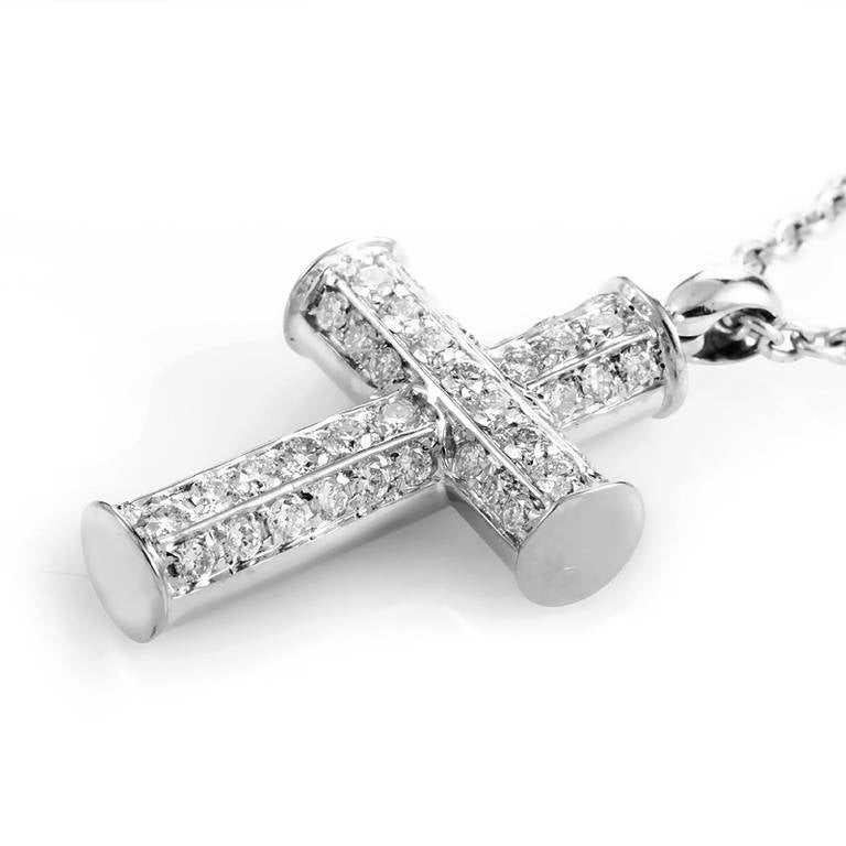 This pendant necklace from Bulgari is refined and elegant; the perfect accessory for a posh lady. The necklace is made of 18K white gold and boasts a crucifix pendant set with ~.46ct of diamonds.
Approximate Dimensions: Drop of the Necklace: 8.75